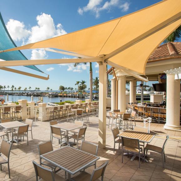 tables and chairs outside nauti mermaid at westin cape coral