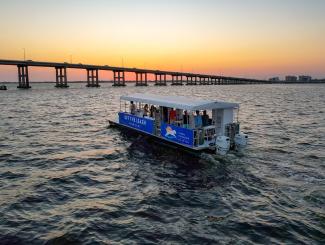 boat in river at sunset