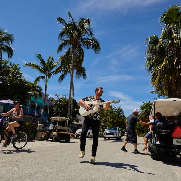 Songwriter with Guitar on Andy Rosse Lane