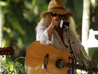 earl bud lee pointing at camera holding guitar